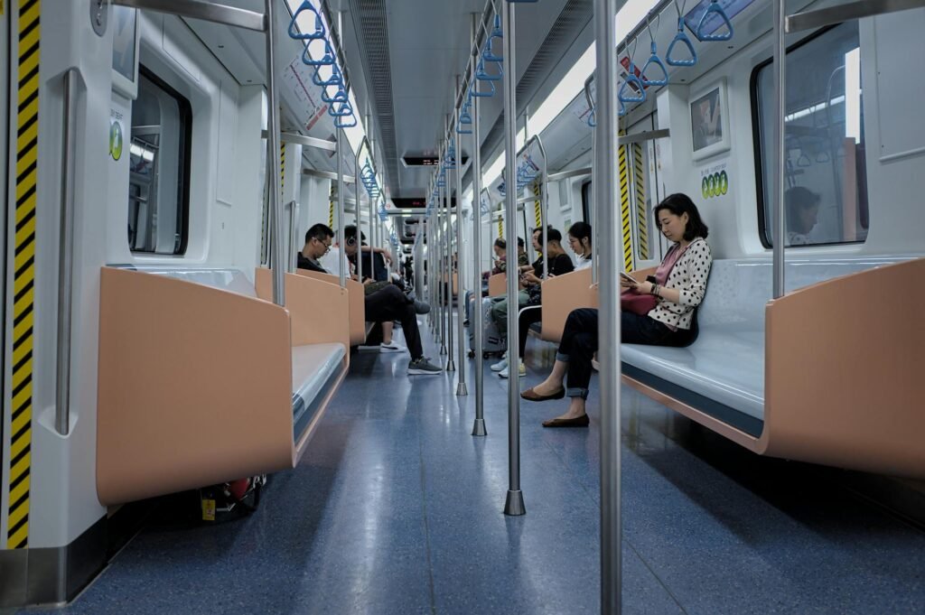 people sitting on train seats while in transit