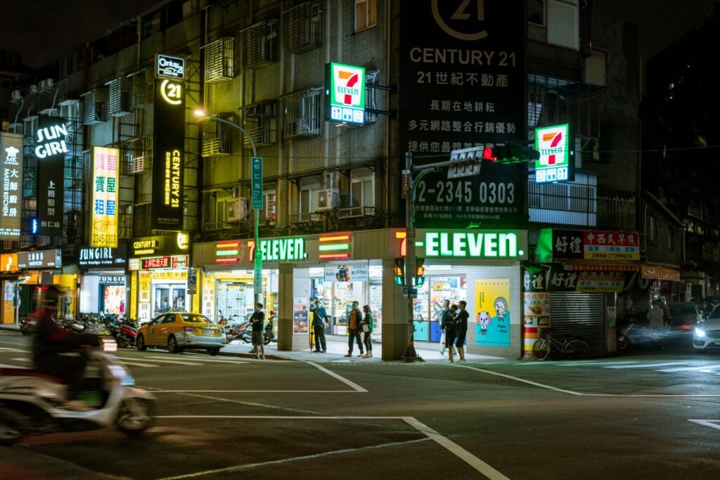 a convenience store in a city at night