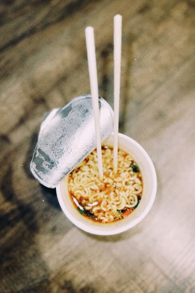 instant noodles in cup with chopsticks